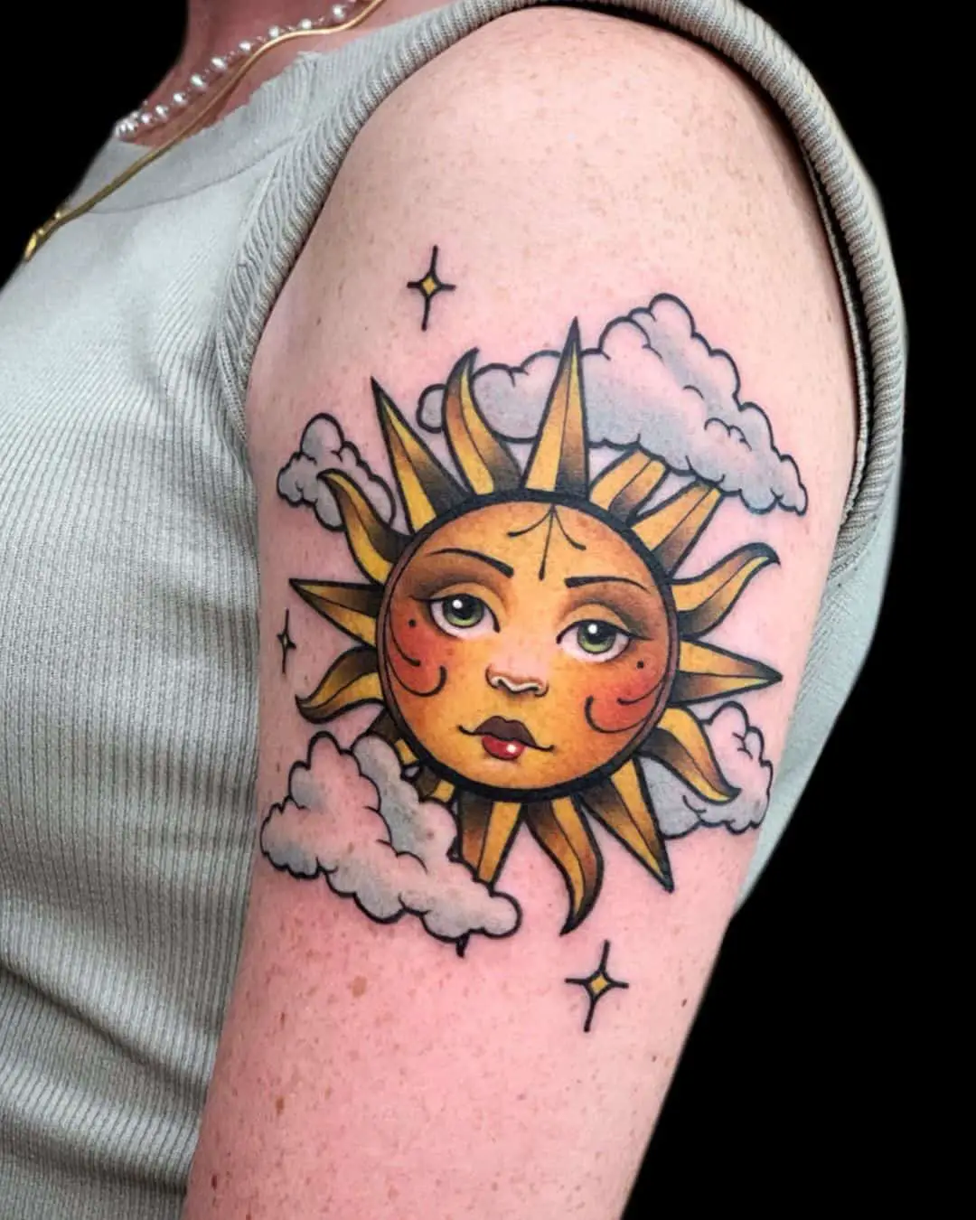 Traditional sun tattoo with cloud