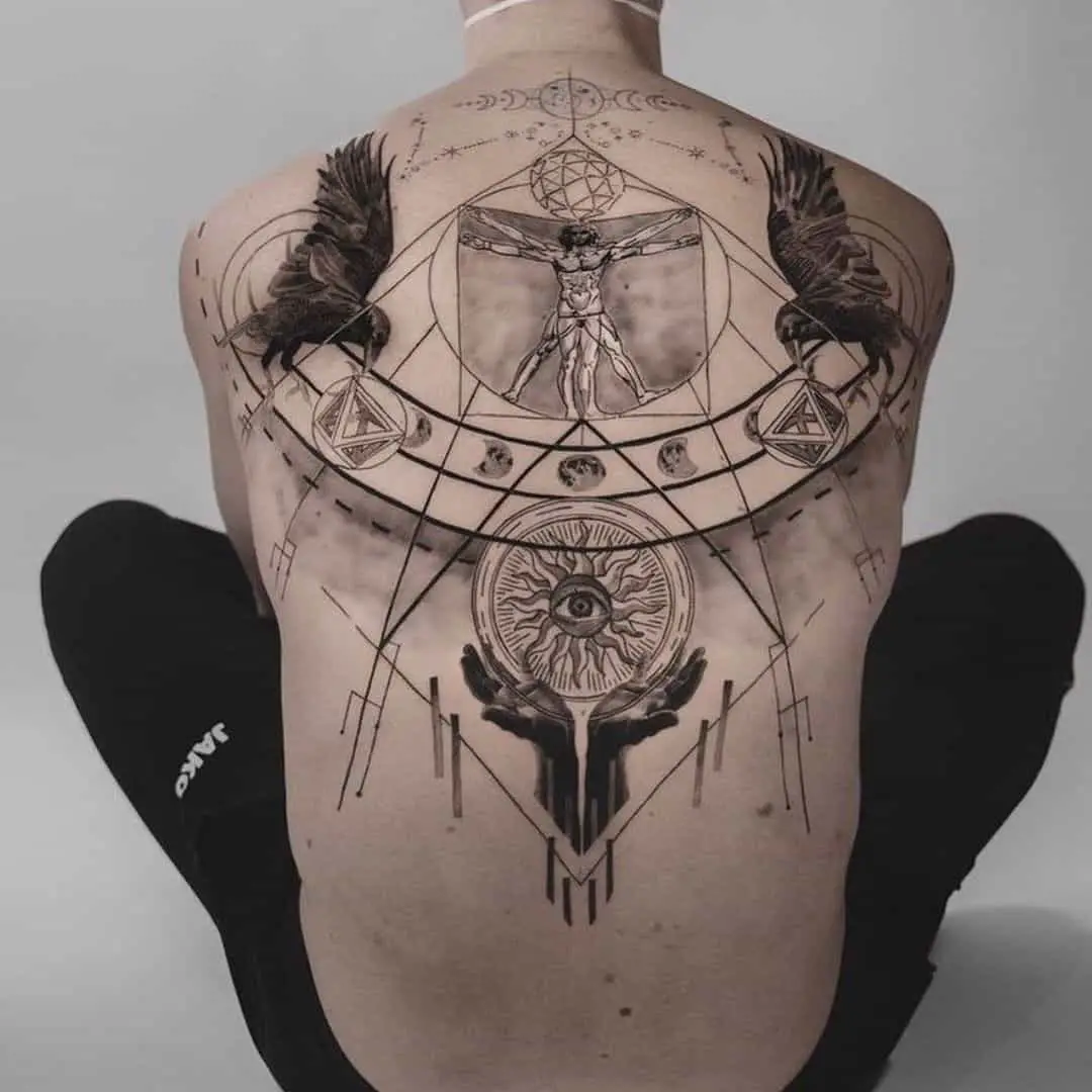 Amazing ravens tattoo on back by ll3.tattoo