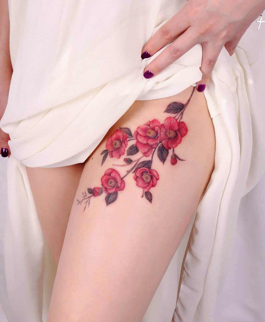 Beautiful camellias flower tattoo on leg by perai tattoo