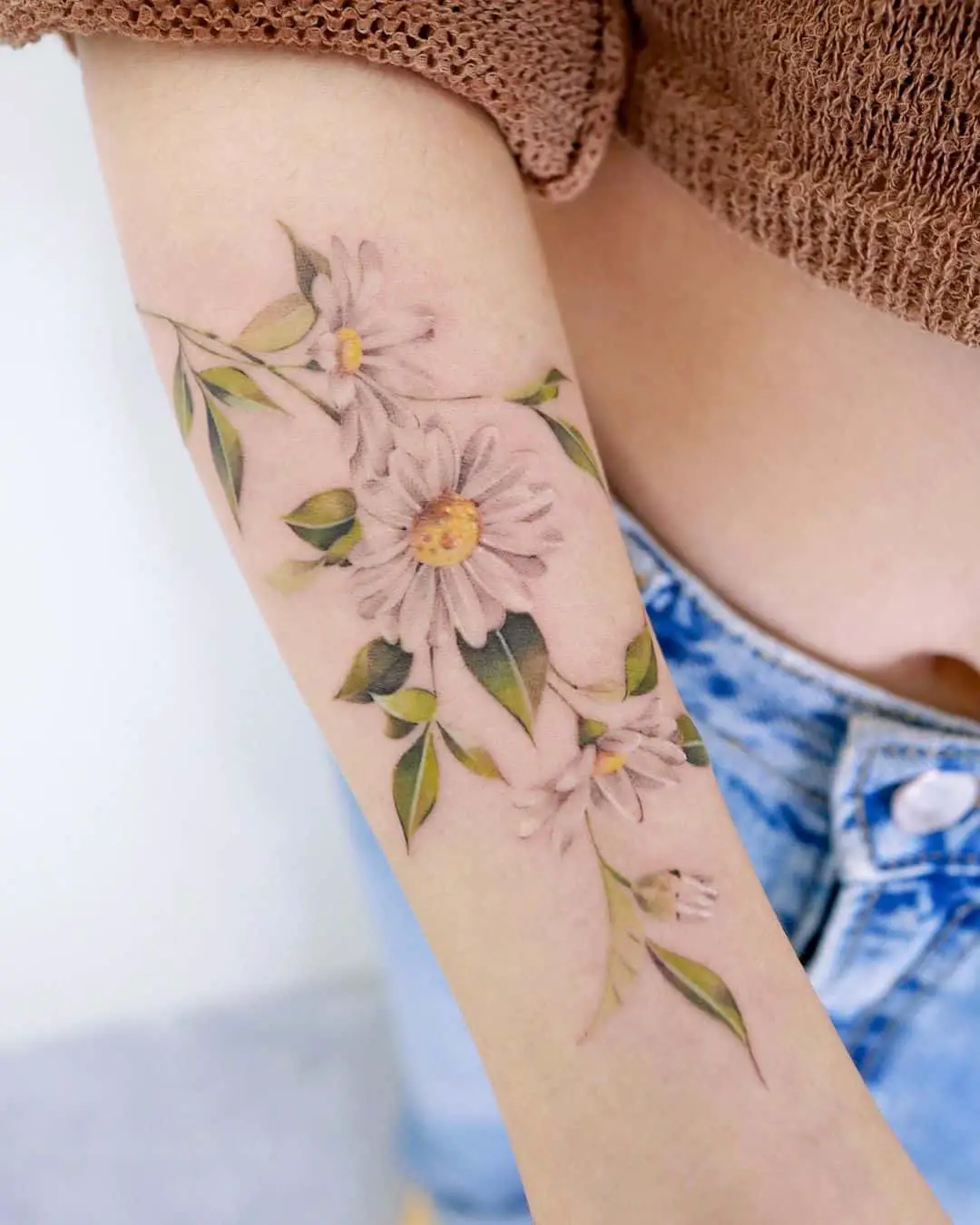 Beautiful daisy tattoo by sozil tattoo