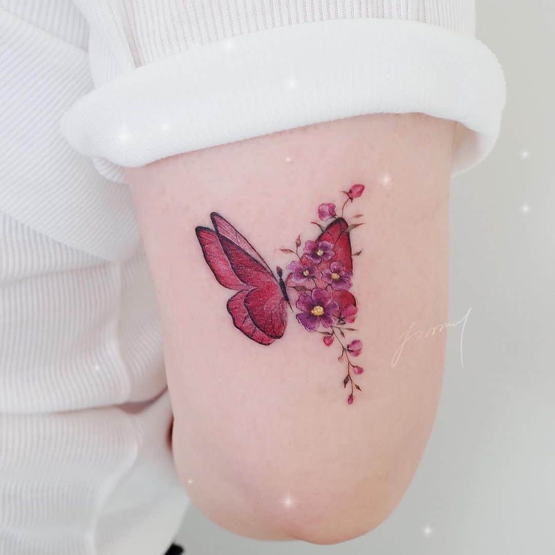 Beautiful flower tattoo with butterfly by tattooist jammy.j