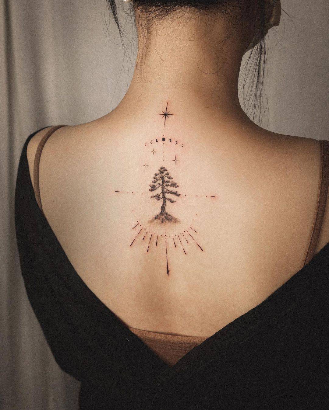 Beautiful pine tree tattoo on back by orma tattoo