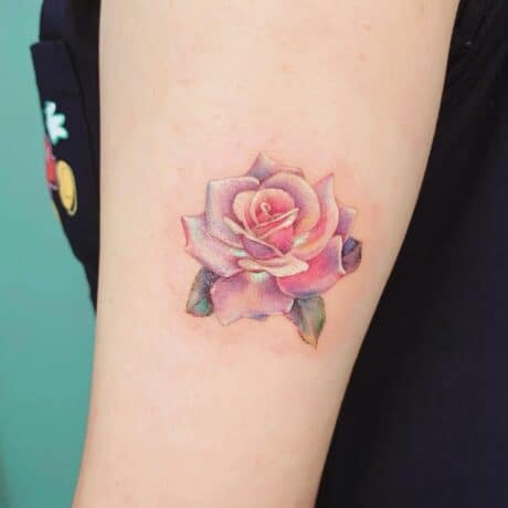 Beautiful rose tattoo by sanatattoos