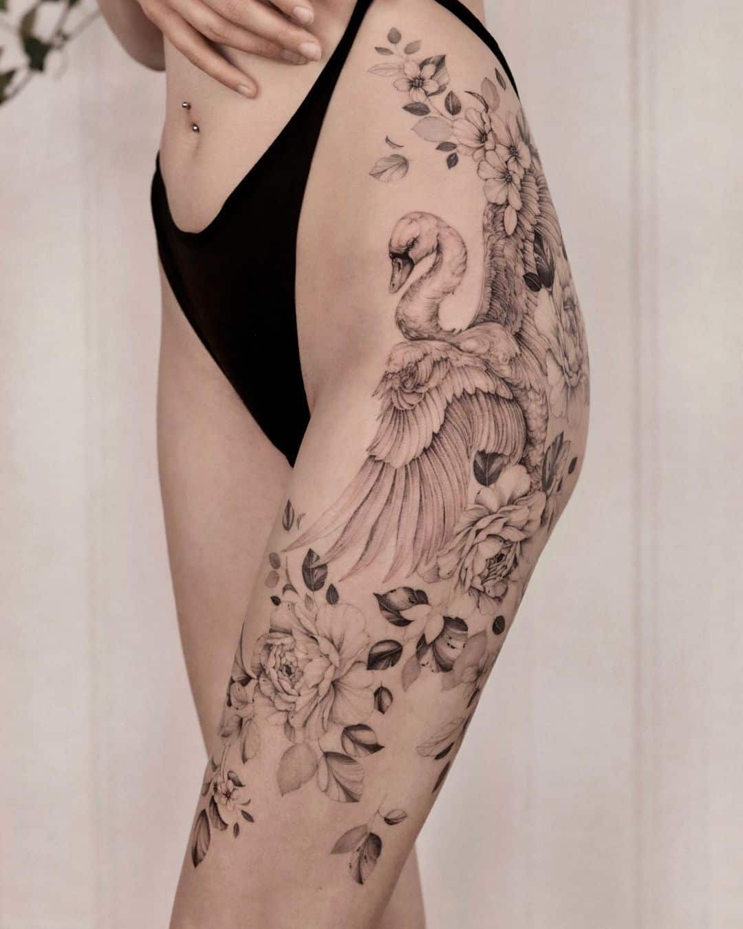 Beautiful swan tattoo on thigh by zuzapolakowska