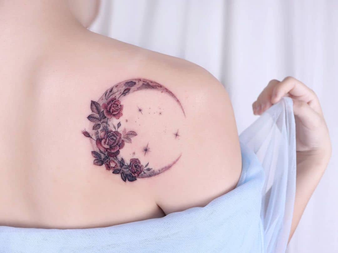 Camellias tattoo with crescent moon by perai tattoo