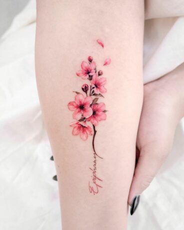 Cherry blossom tattoo on arm by donghwa tattoo