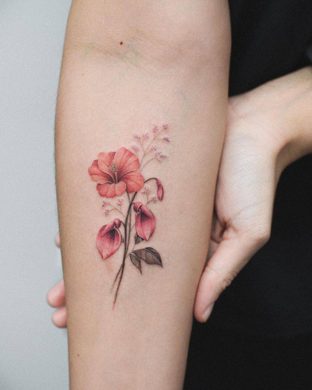 Colored flower tattoo on arm by bryan.gee