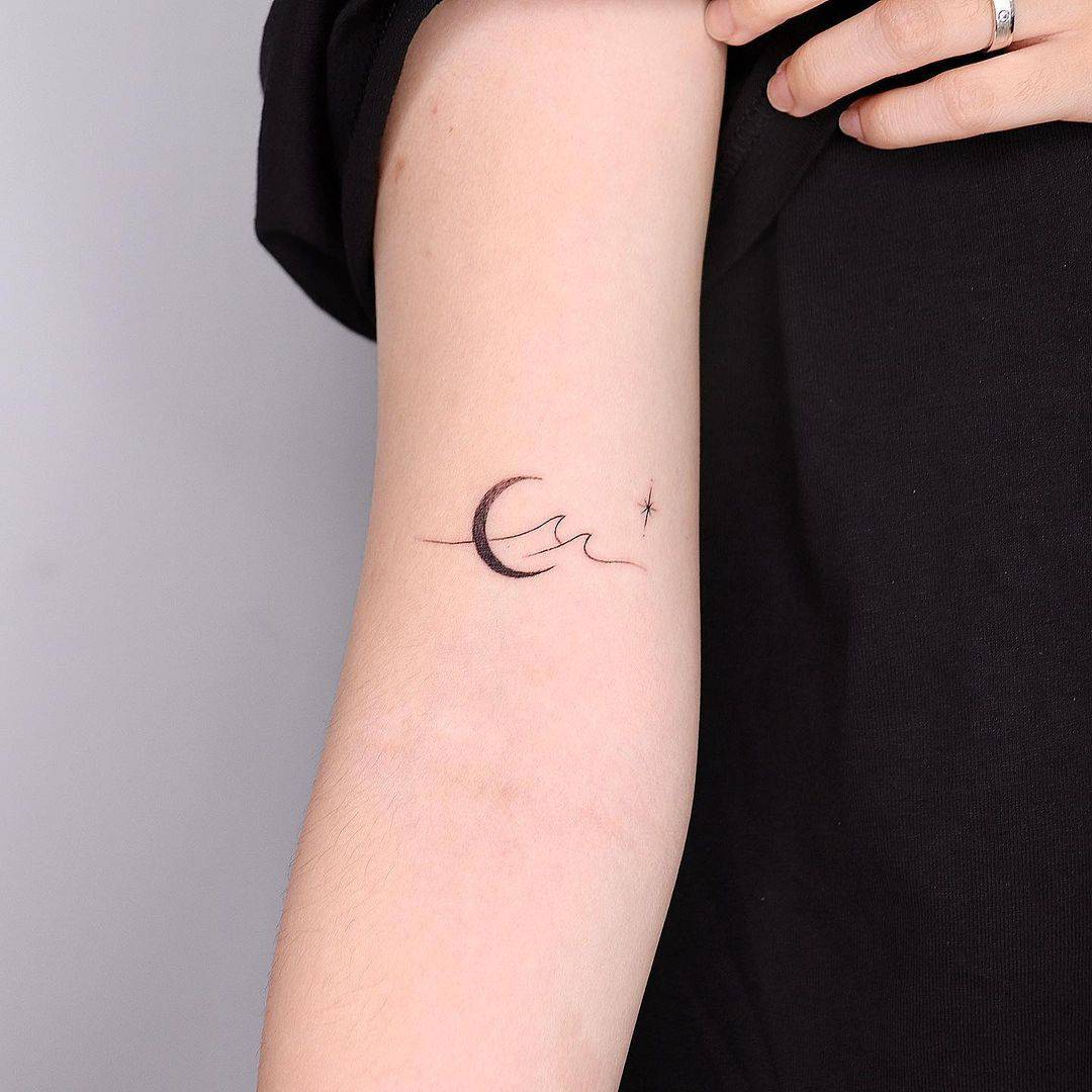 Cute star and moon tattoo by tattooist bear