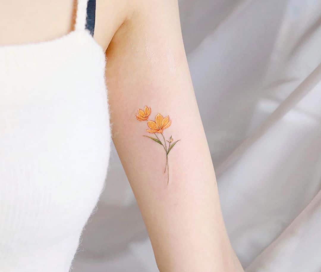 Flower tattoo on arm by vane.tattoo