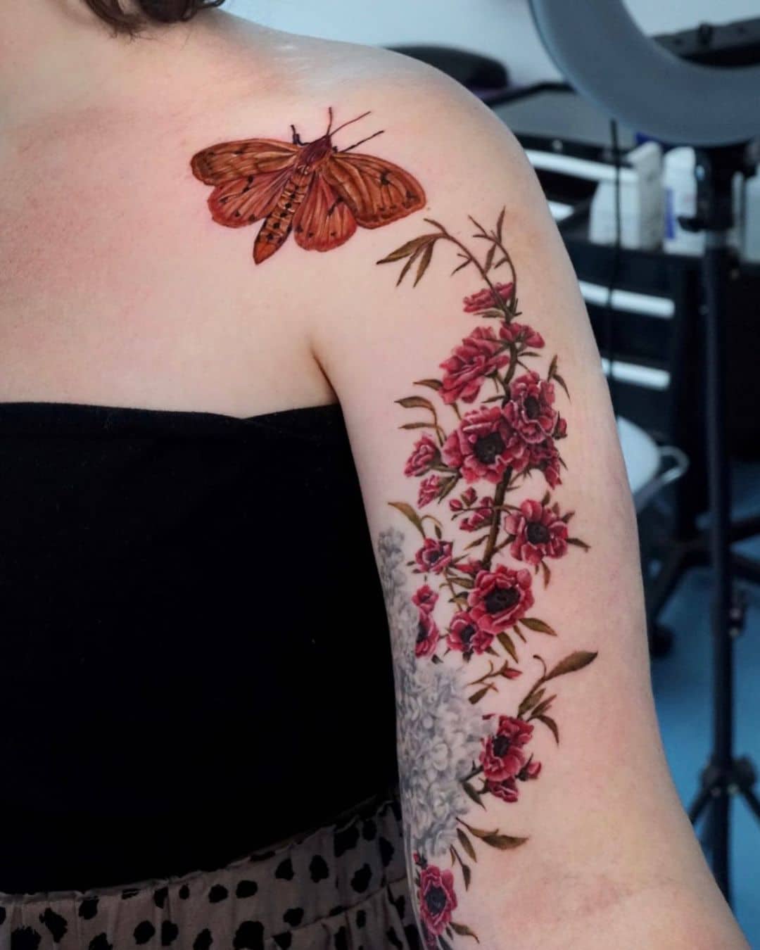 Flower tattoo with butterfly on rm by woni plant