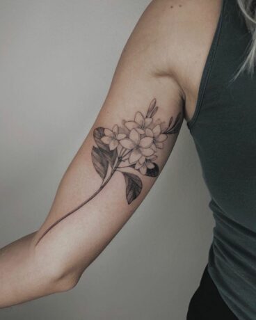 Fragipani tattoo on arm by korpus domini torino
