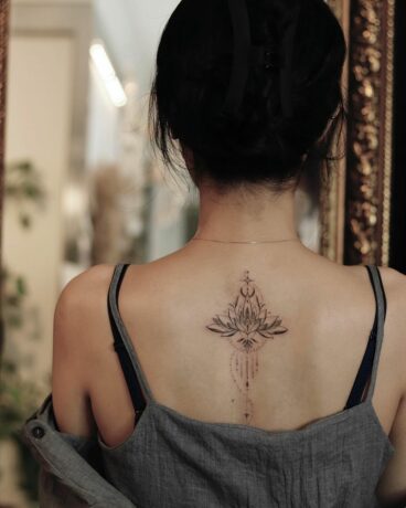 Beautiful lotus tattoo on back
