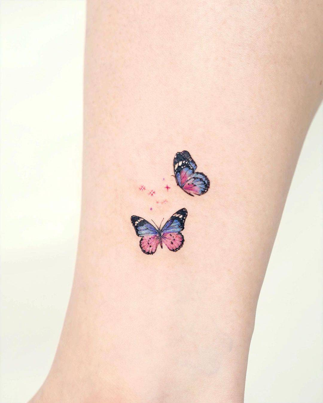 Mini Star tattoo with butterfly tattoo by tilda tattoo
