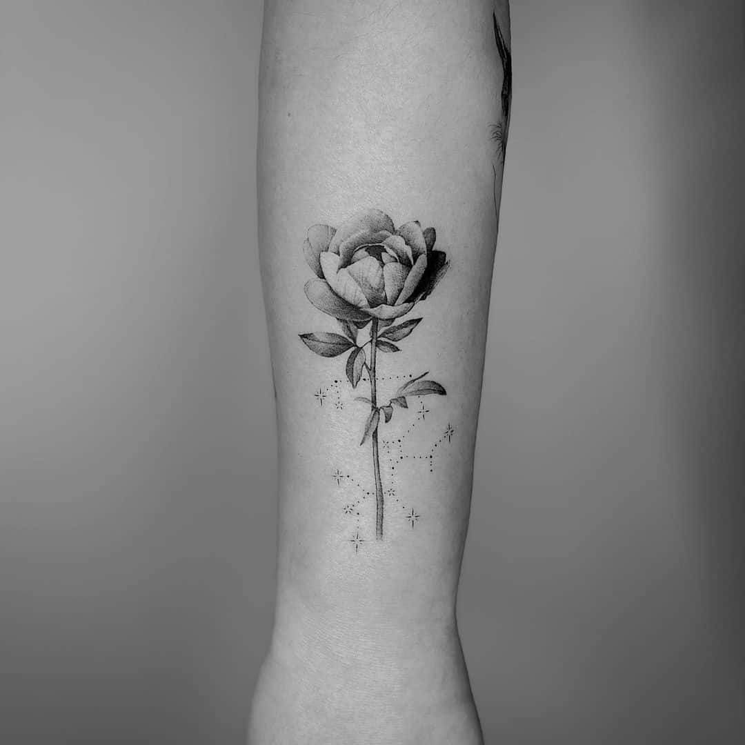 Peony tattoo on arm by rose a line.tattoo