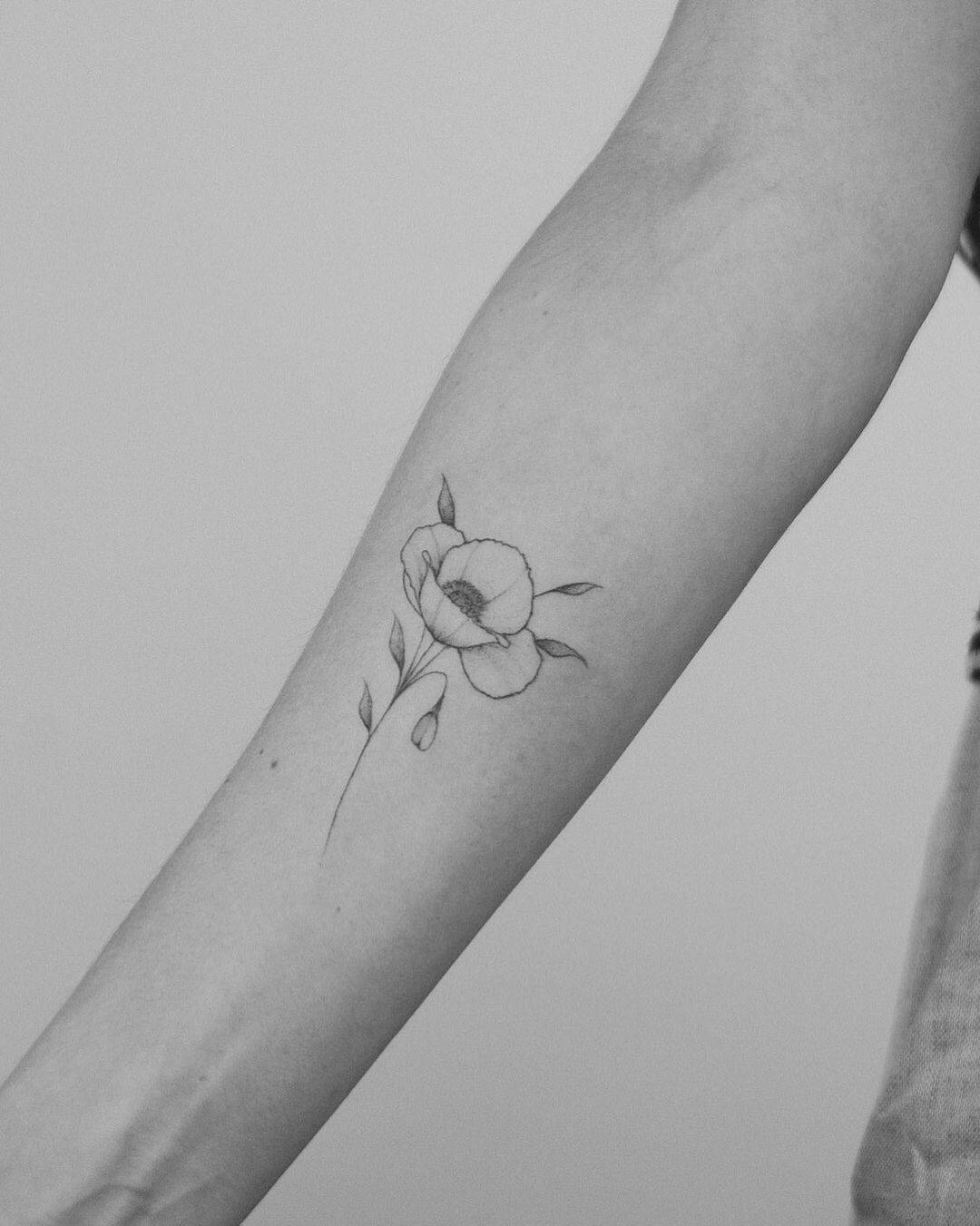 Simple line flower tattoo on arm by alejo tats