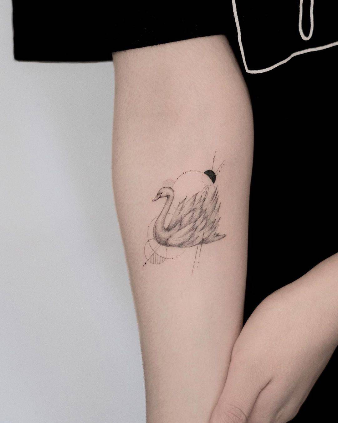 Simple swan tattoo on arm sleeve by jk.tattoo