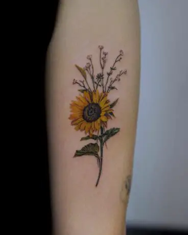 Single sunflower tattoo by woni plant