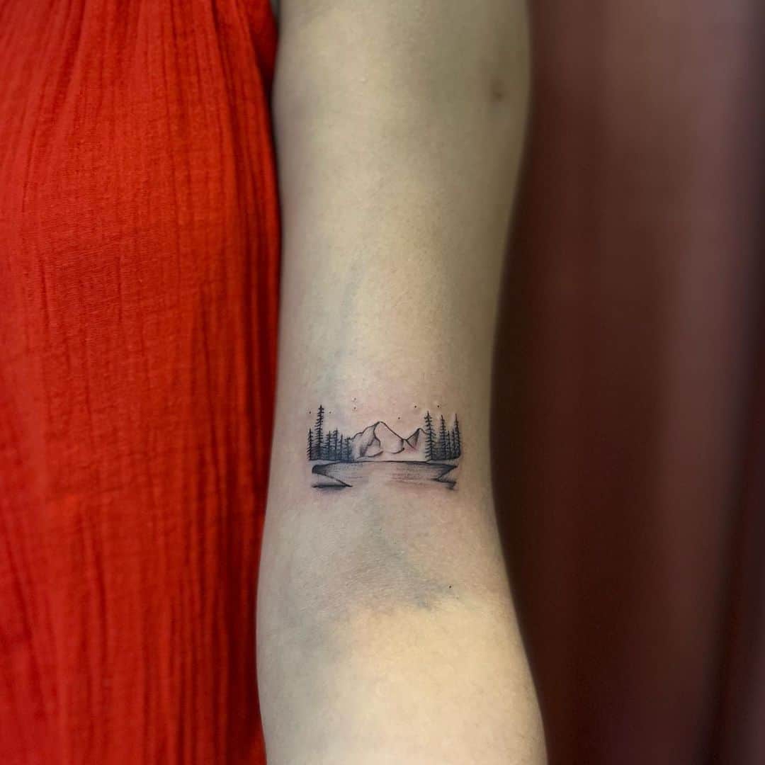 Small and cute mountain forest tattoo by tattoozbygourav
