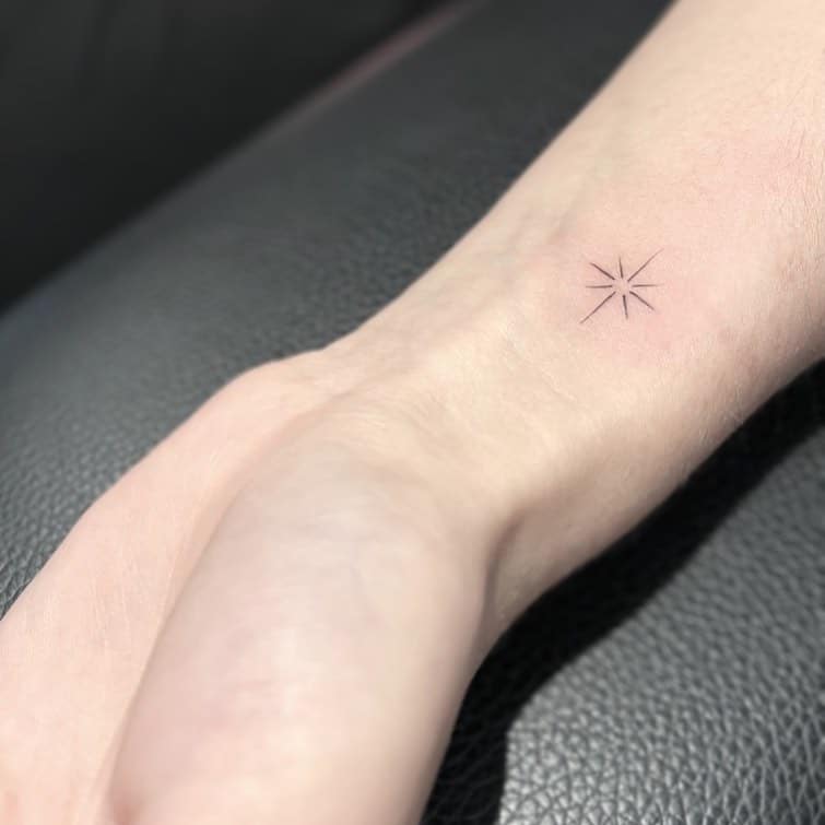 Small star tattoo on wrist by sutattoosd