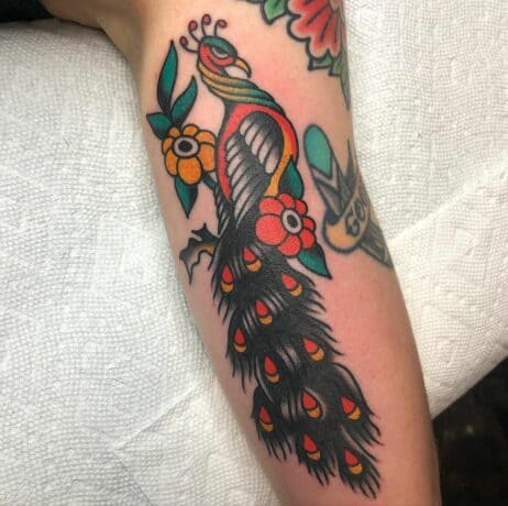 Traditional peacock tattoo on leg by davelurks