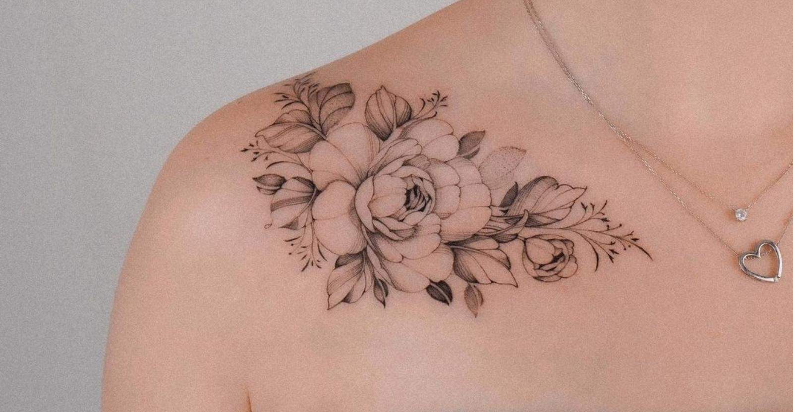 flower tattoo on womens collar bone