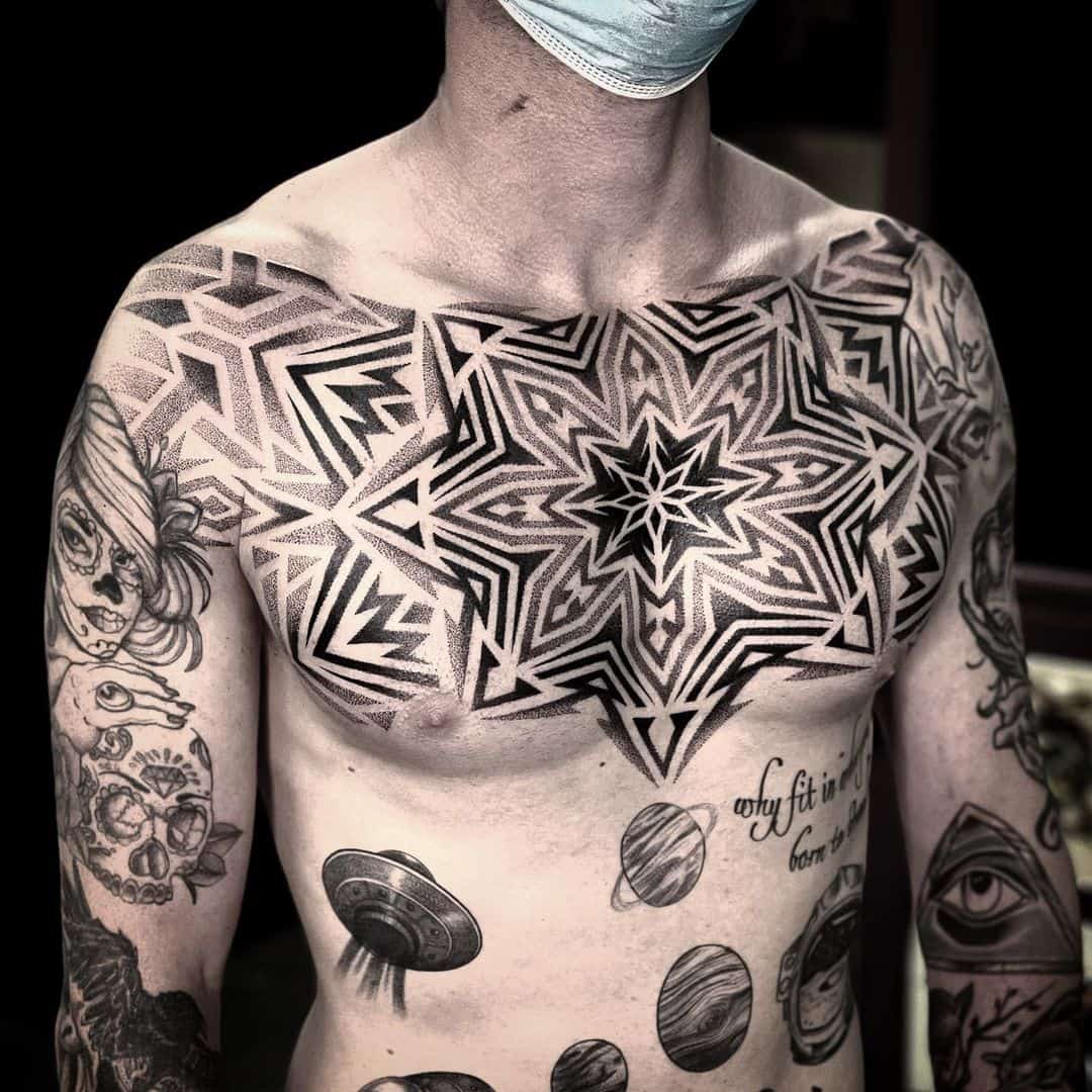 Amazing geometrci tattoo on chest by liris.ink
