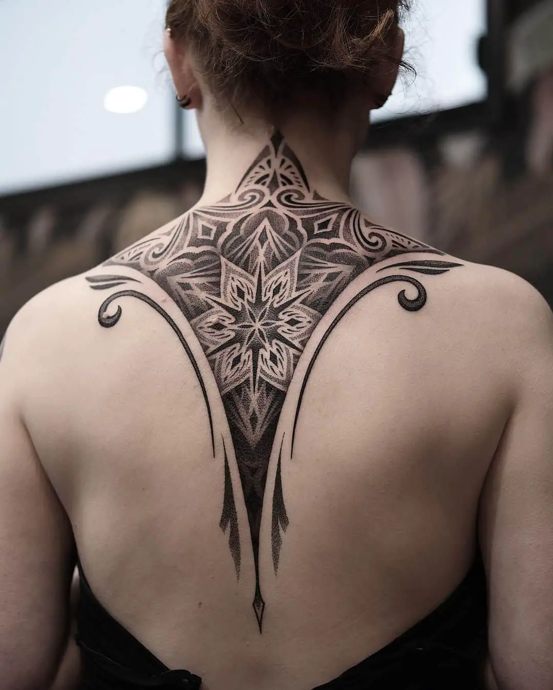 Amazing geometric tattoo on back by liris.ink