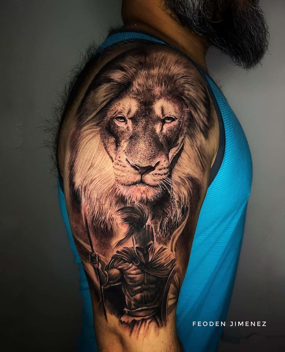 Amazing lion tattoo on upper arm by feoden jimenez