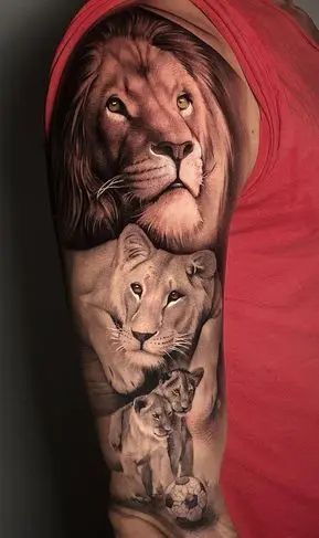 Beautiful lion and lioness tattoo on upper arm