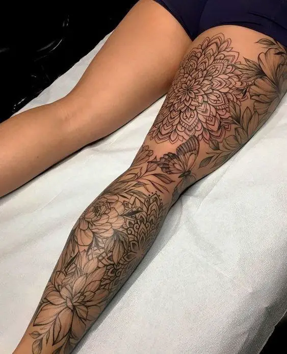 Fine line geometric tattoo on thigh