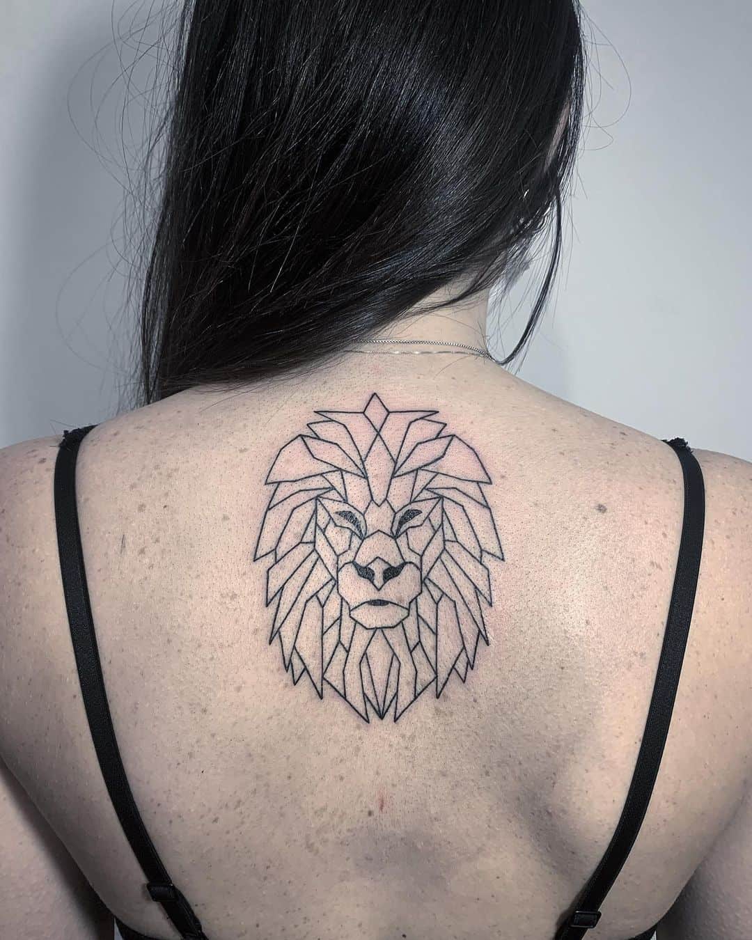 Fineline lion geometric tattoo by trick tattoo artist