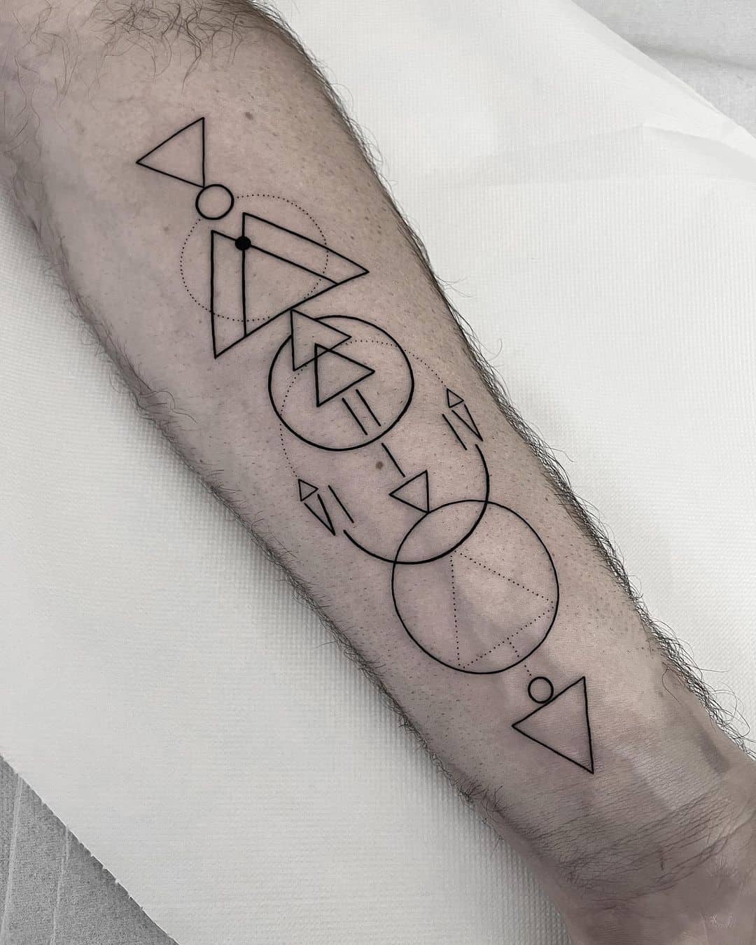 Geometric tattoo on lower arm by anza data