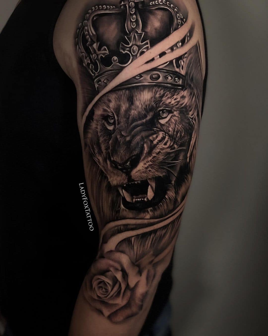 Lion tattoo with cron and rose by