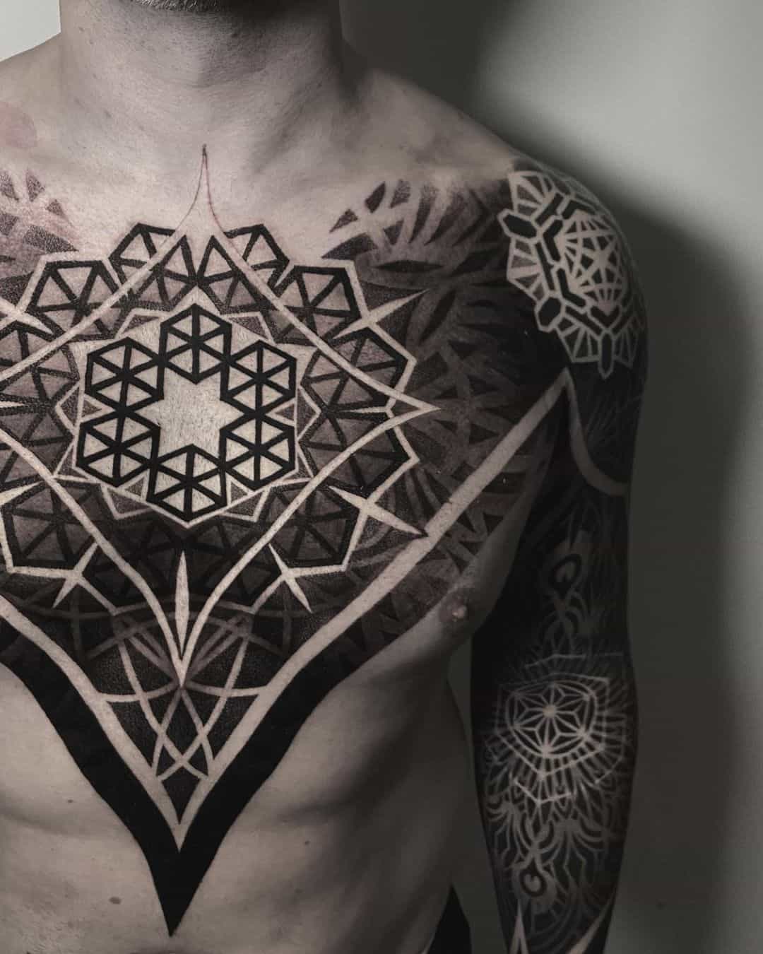geometric tattoo on chest by tohaeltattoo