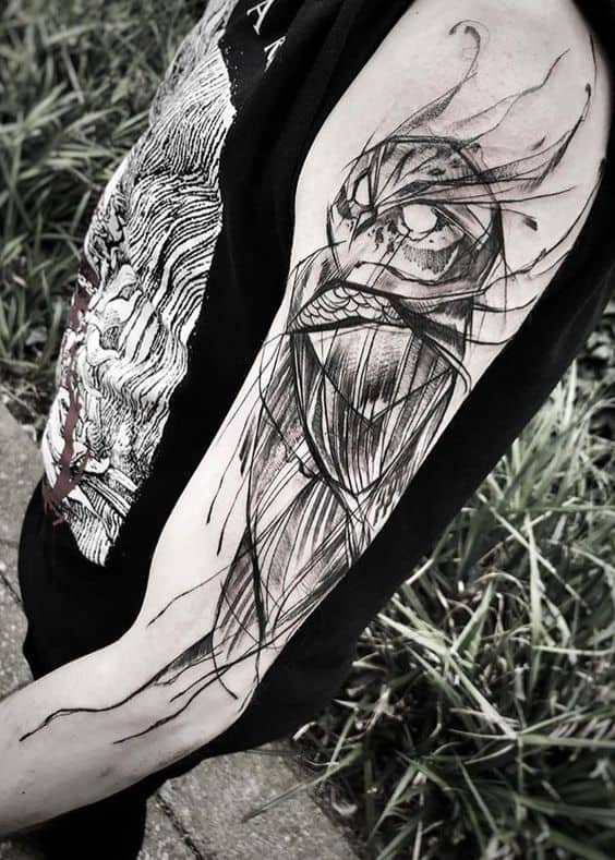 Abstract owl tattoos on arm