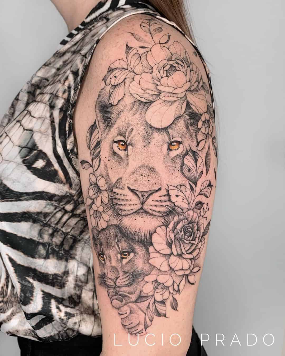 Amazing Lion tattoo with flower on arm