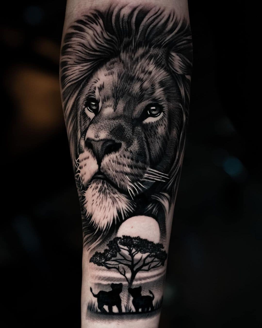 Amazing black and gray inked lion tattoo by live with ink