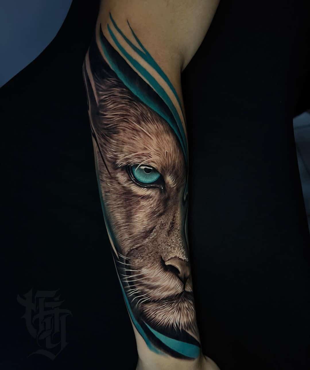 Amazing lion tattoo on forearm by crazyhome tattoo