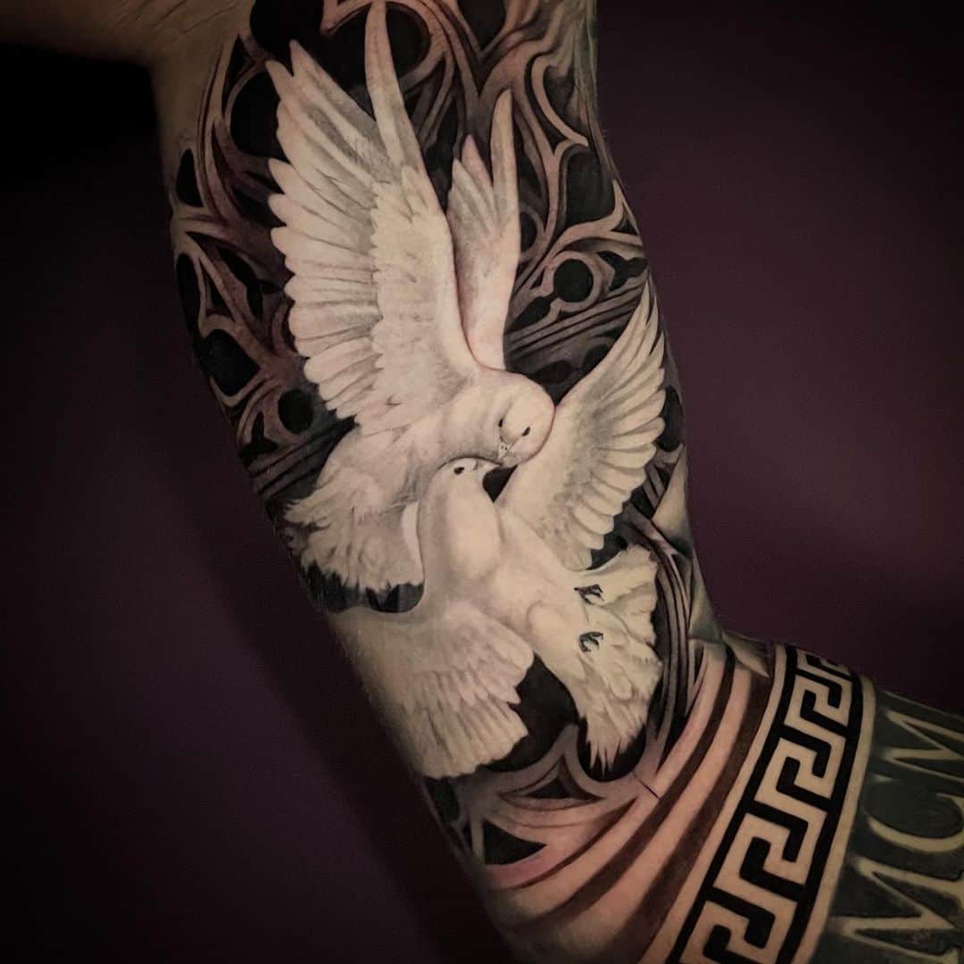 Amazing pigeons tattoo design on arm by zane1 ink