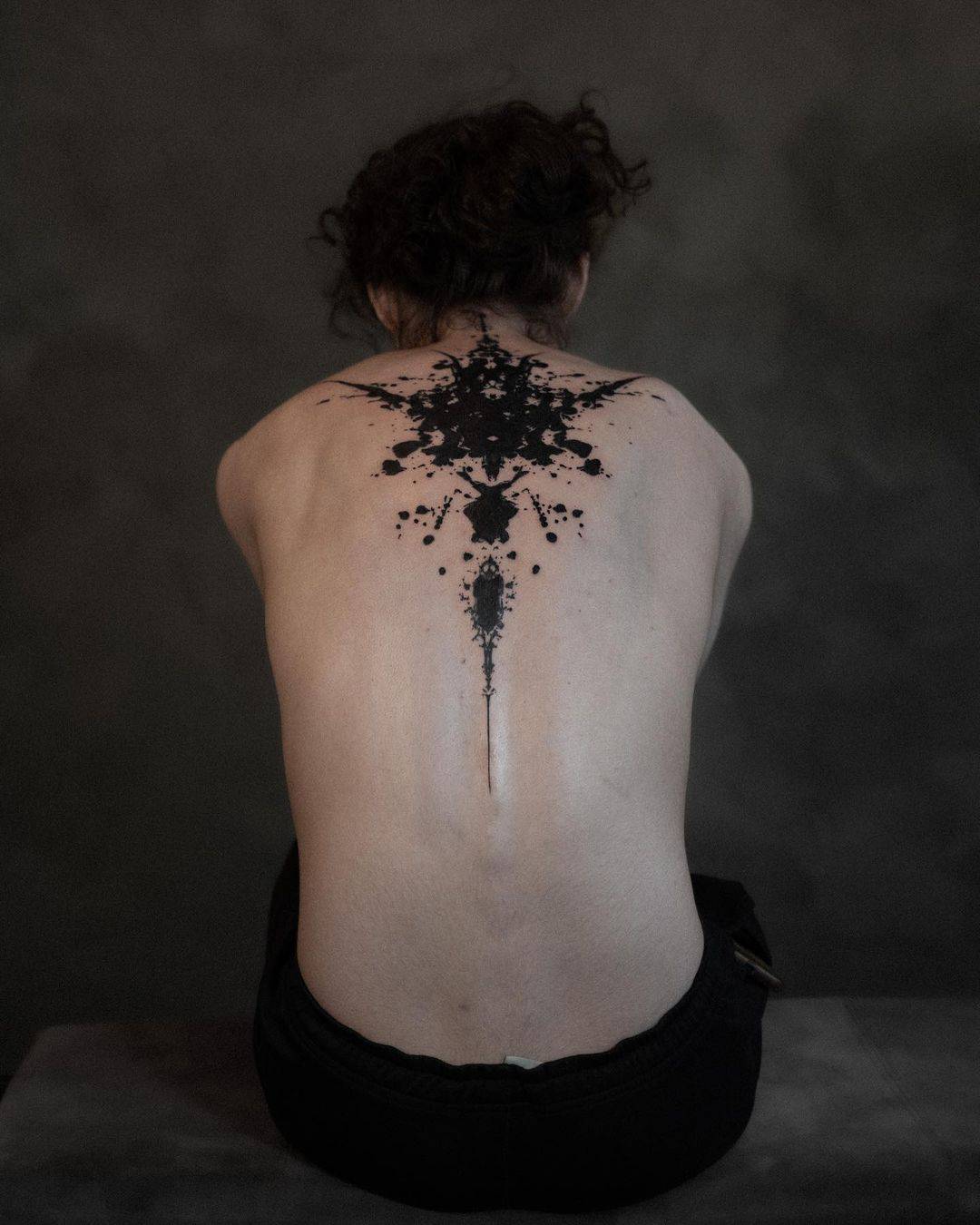 Amazing tattoo on back by contemporry tttism