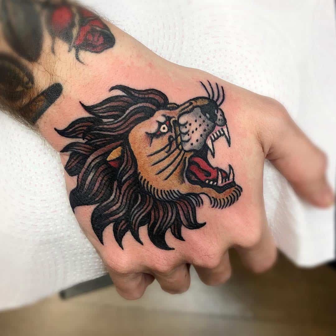 Traditional lion tattoo on hand.