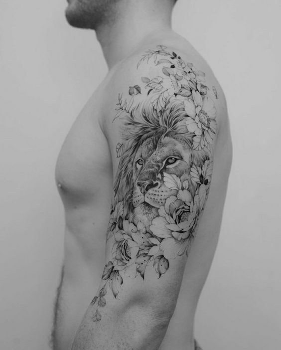 Amazing upper arm lion tattoo with flower