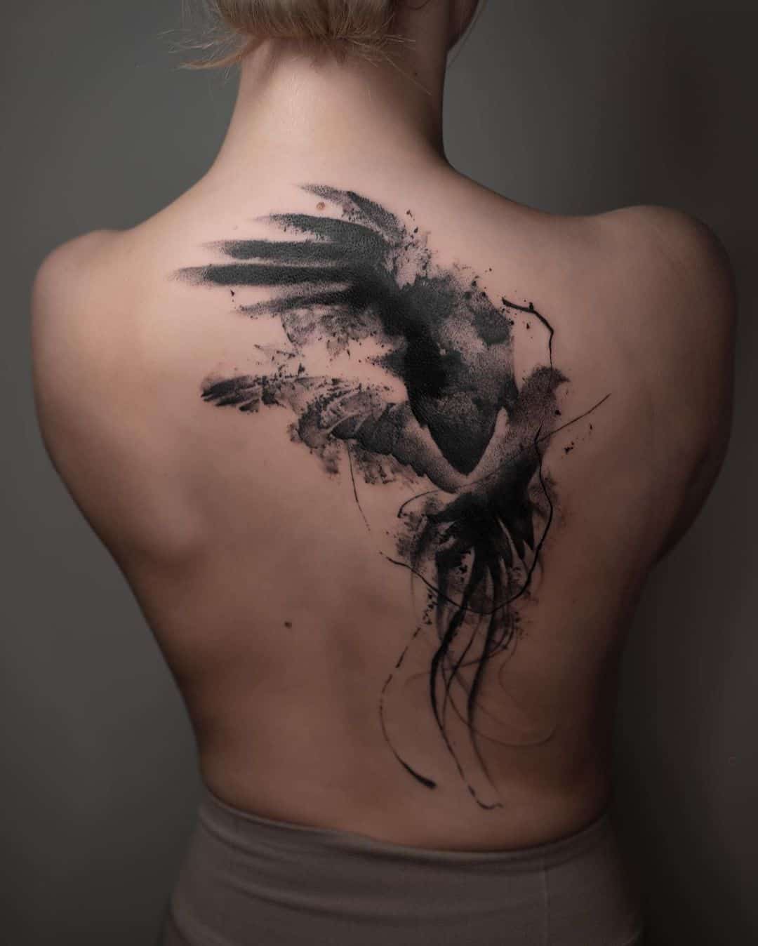 Beaautiful bird abstract tattoo on back by noiiberlin