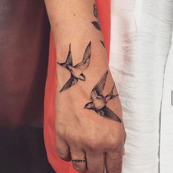 Beautiful Birds tattoo on hand