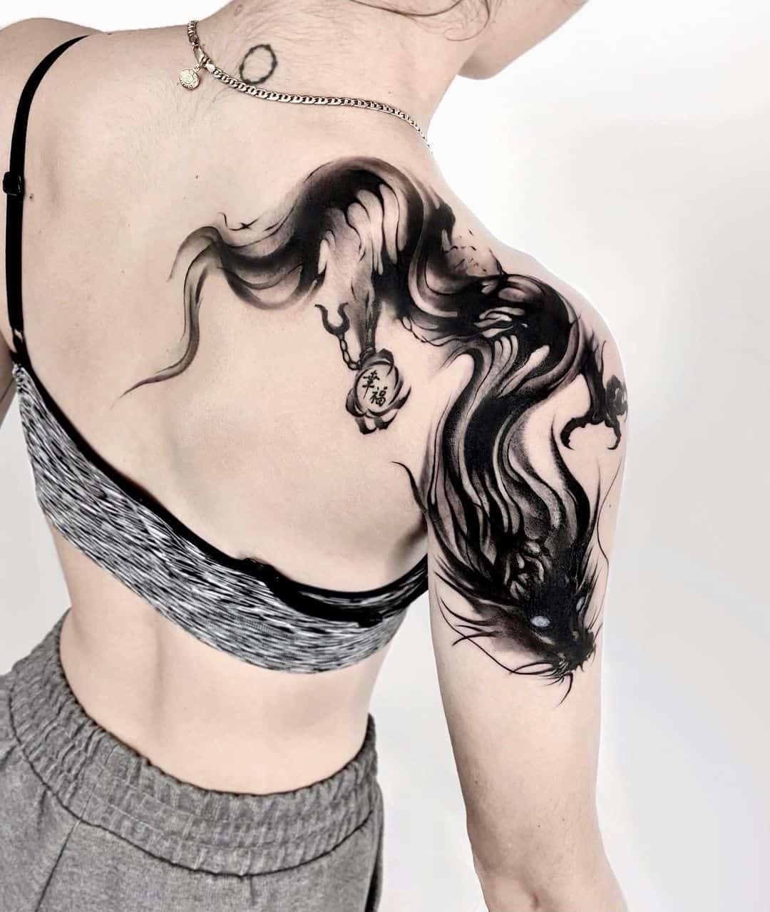 Beautiful abstract dragon tattoo on shoulder by jing.tattoo