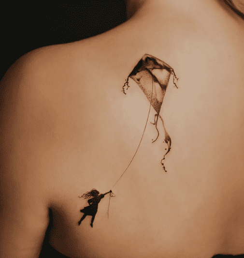 Beautiful abstract tattoo on back of kite and girl by magneticmark