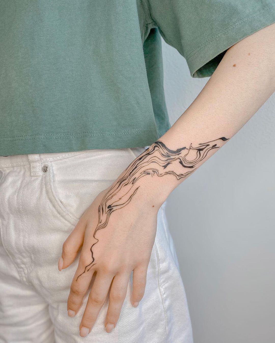 Beautiful abstract tattoo on hand by liza from kingst.collective