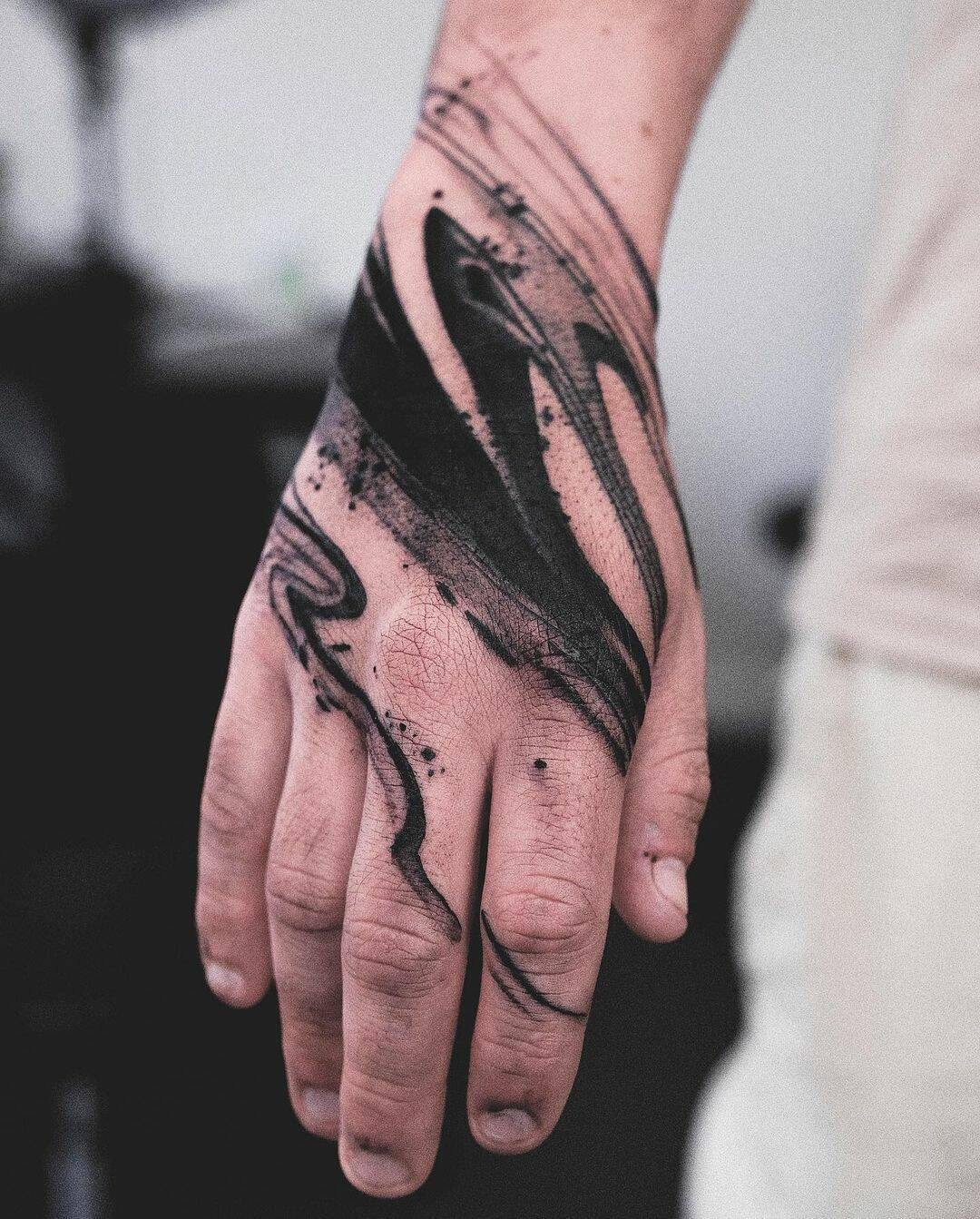 Beautiful abstract tattoo on hand by who is ryu