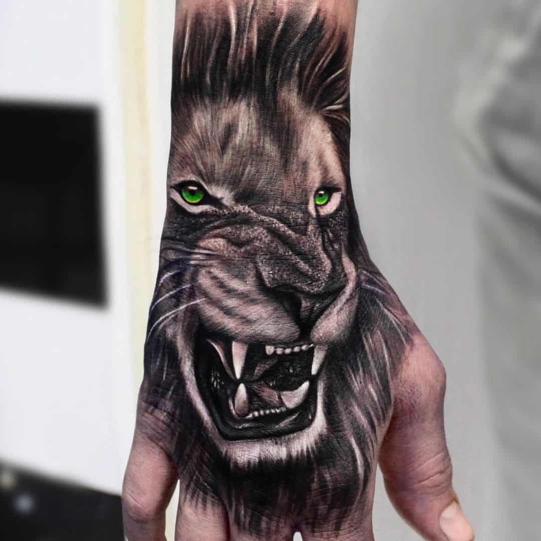 Beautiful green eyes lion tattoo by cristianogiovannini tattoo