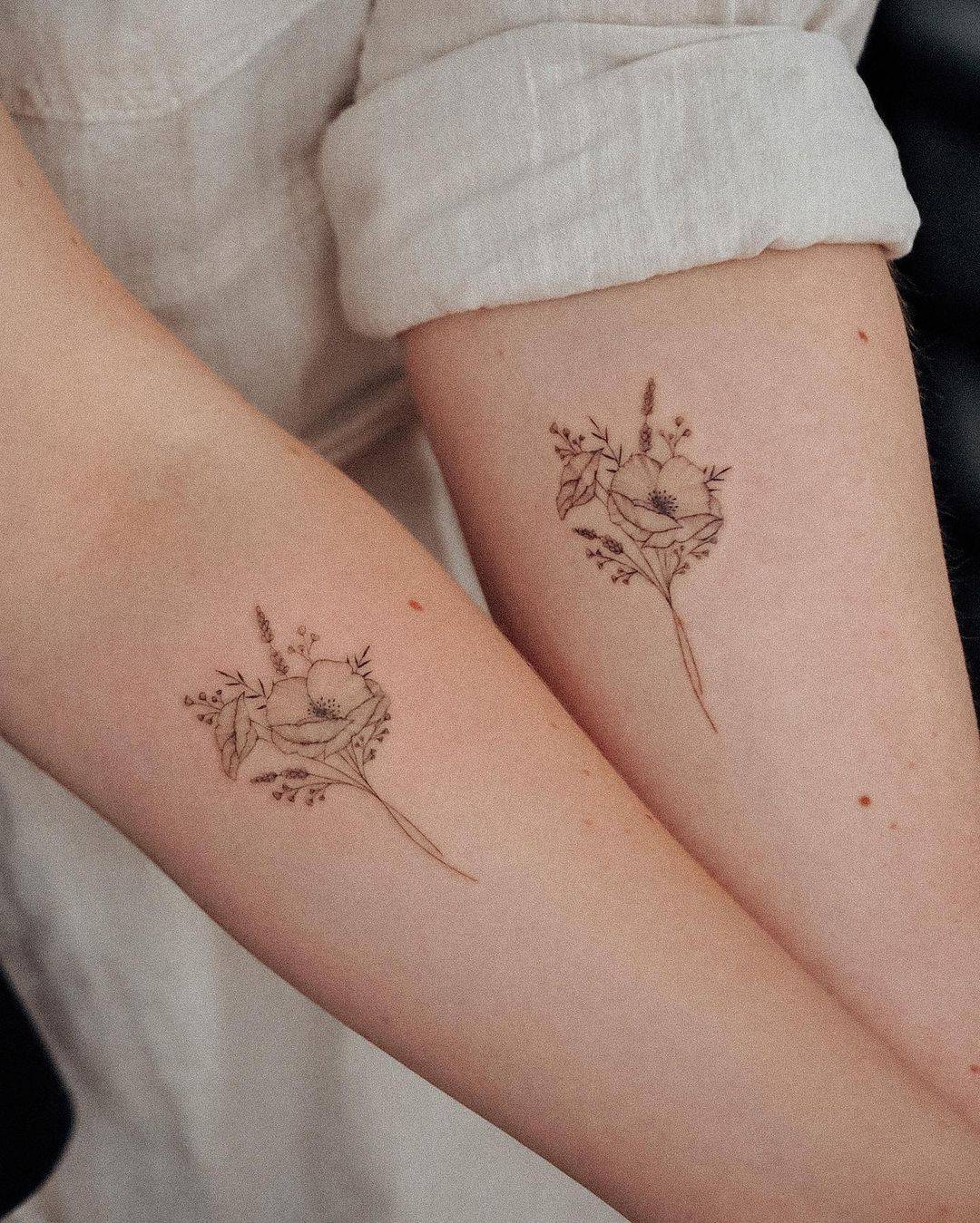 Beautiful matching flower tattoo design by bunami.ink
